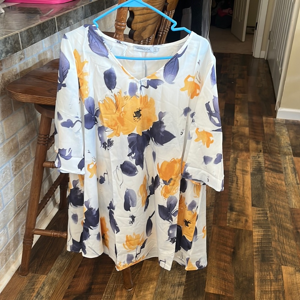 Ladies tunic top. Never worn. White with blue and yellow floral design.